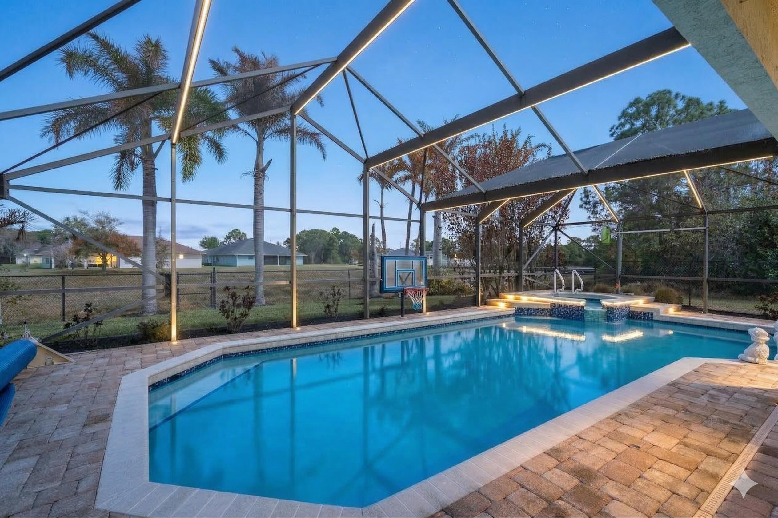 5593 Northwest Wesley Road Port St. Lucie, FL 34986 - Photo 21 of 33 Twilight pool photo