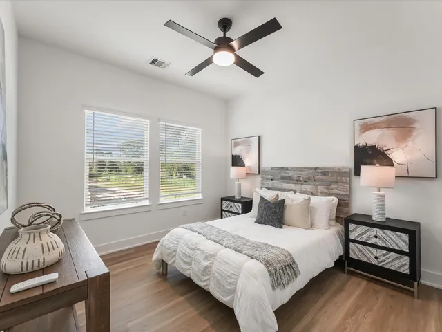 a bedroom with a bed and a window