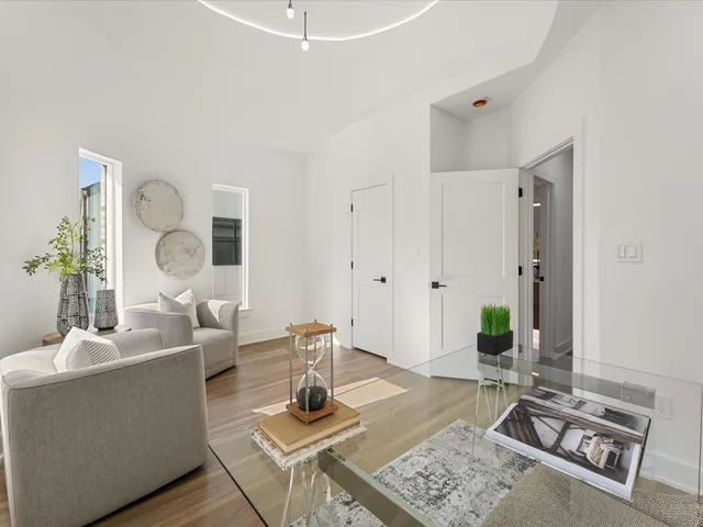 a living room with furniture and next to a window