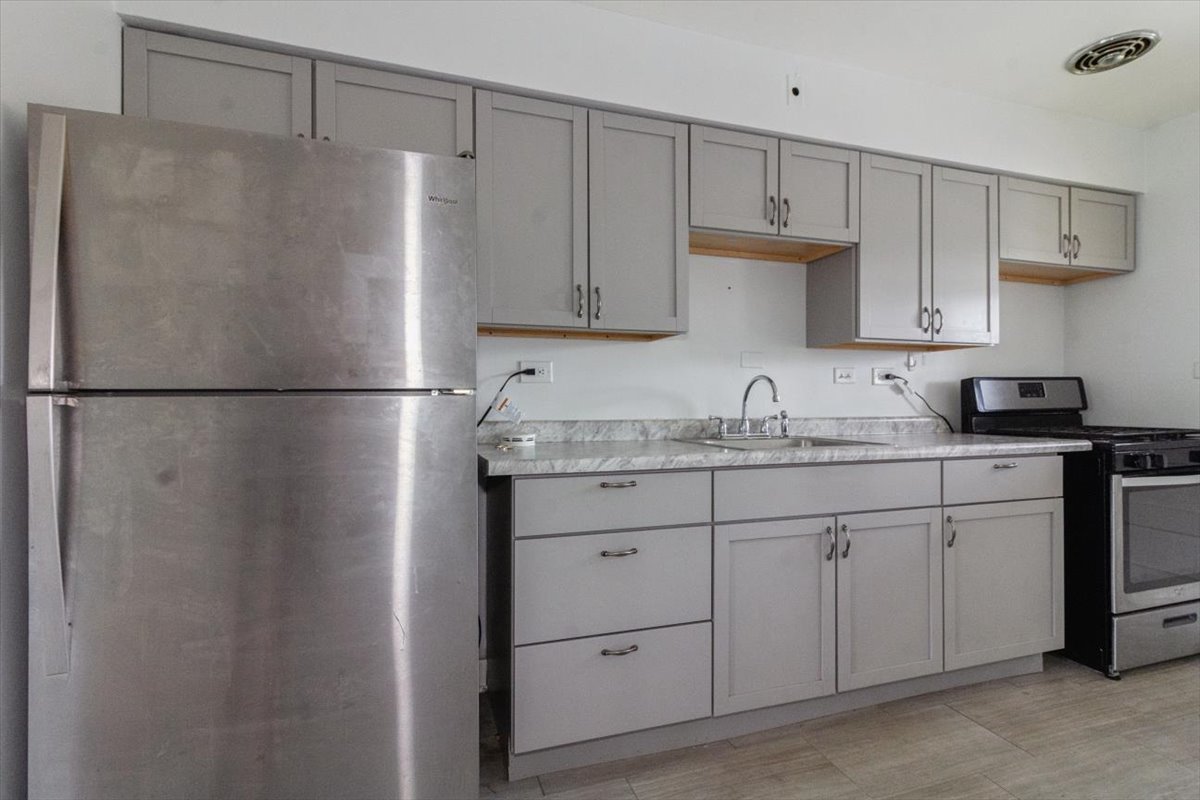 1211 Homestead Road La Grange Park, IL 60526 - Photo 11 of 18 a kitchen with cabinets appliances and cabinets