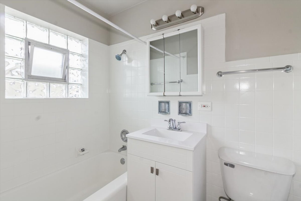 1211 Homestead Road La Grange Park, IL 60526 - Photo 16 of 18 a bathroom with a sink a toilet and shower