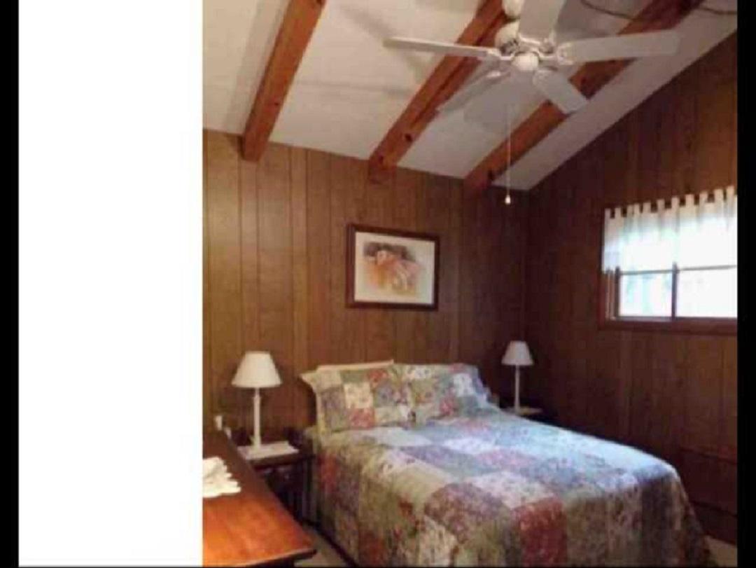 431 Monte Vista Road Union Hall, VA 24176 - Photo 6 of 14 a bedroom with a bed and a painting on the wall