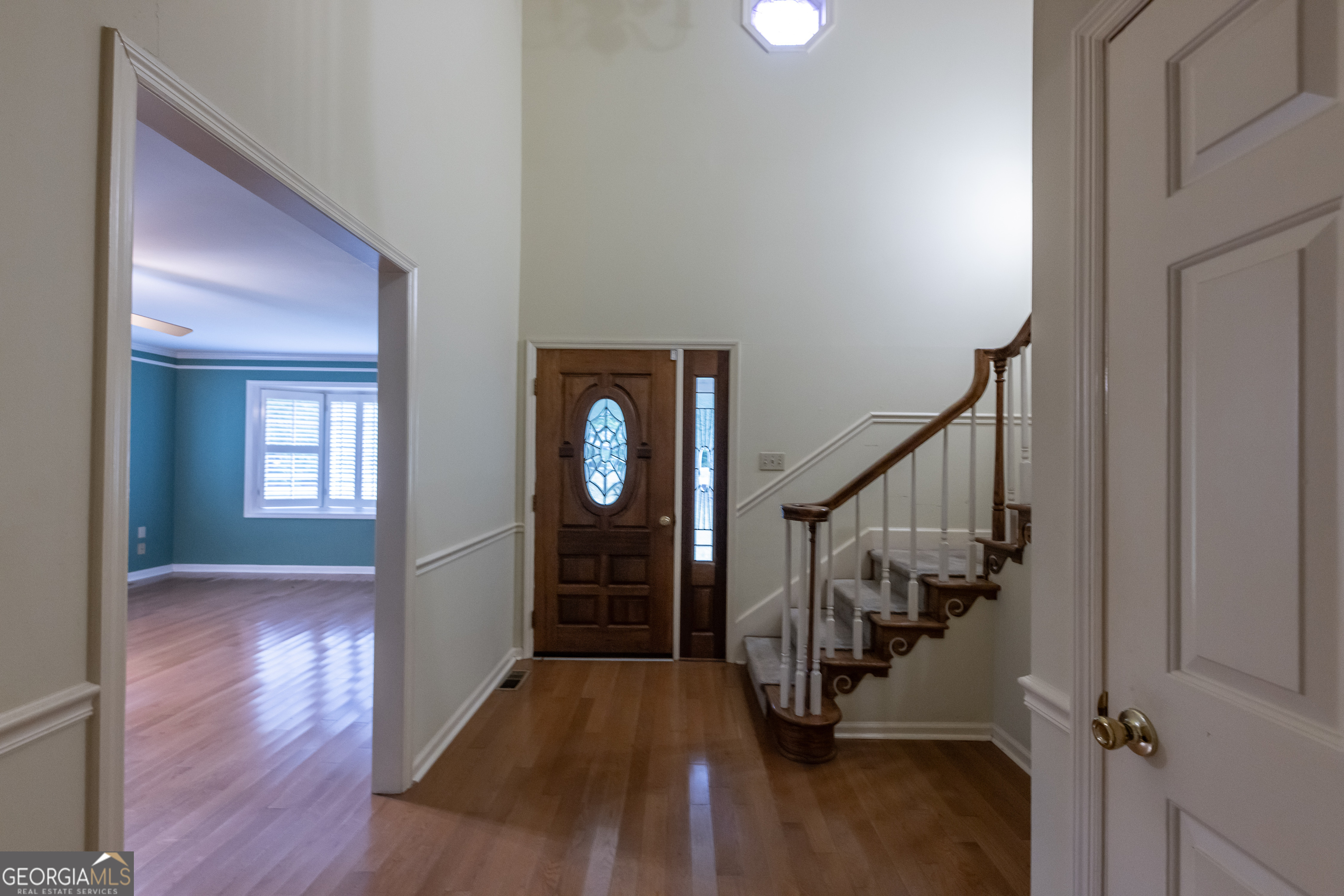 124 David Drive Thomaston, GA 30286 - Photo 16 of 43 a view of a hallway with wooden floor and staircase