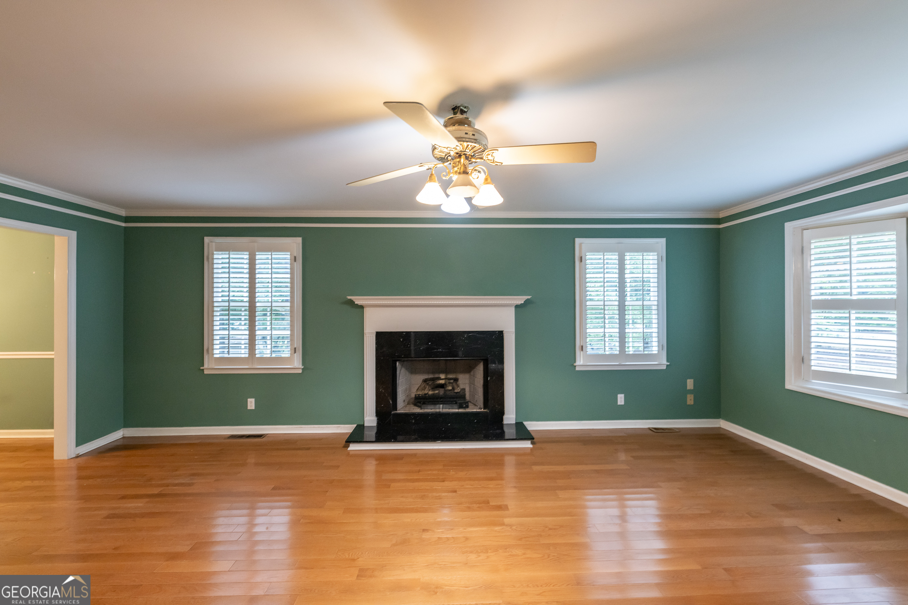 124 David Drive Thomaston, GA 30286 - Photo 4 of 43 a view of an empty room with window and fire place