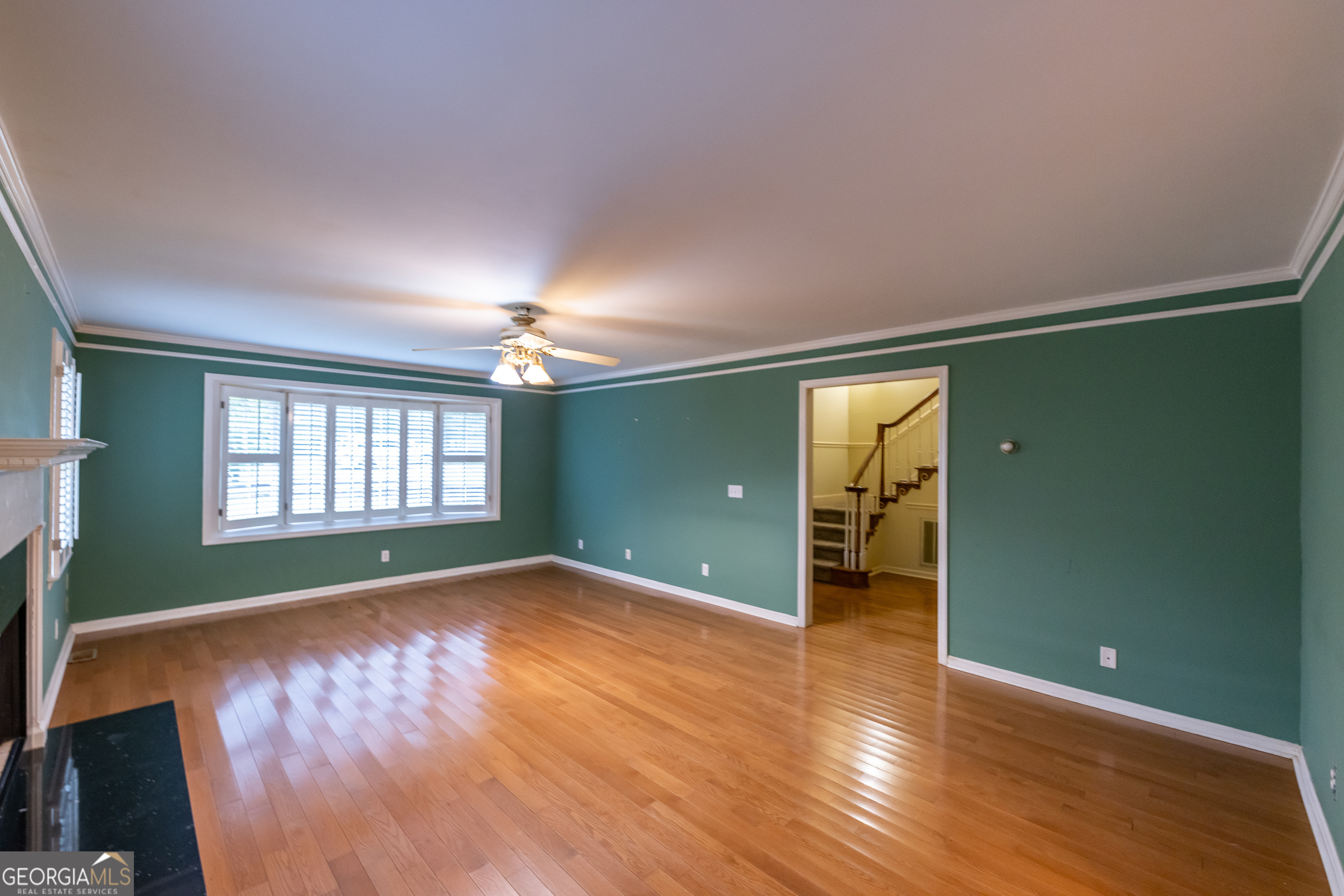 124 David Drive Thomaston, GA 30286 - Photo 5 of 43 wooden floor in an empty room with a window