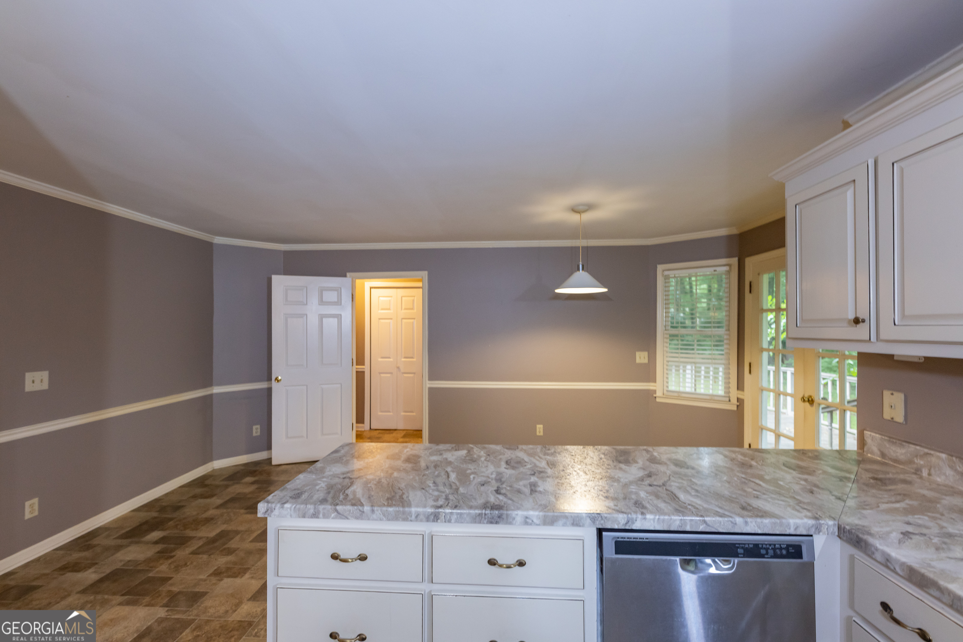 124 David Drive Thomaston, GA 30286 - Photo 7 of 43 a kitchen with granite countertop a sink window and cabinets