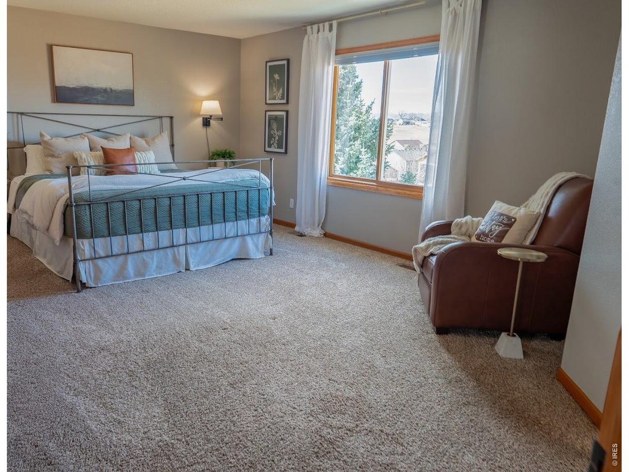 539 South 9th Street Berthoud, CO 80513 - Photo 10 of 37 a bedroom with a bed and window