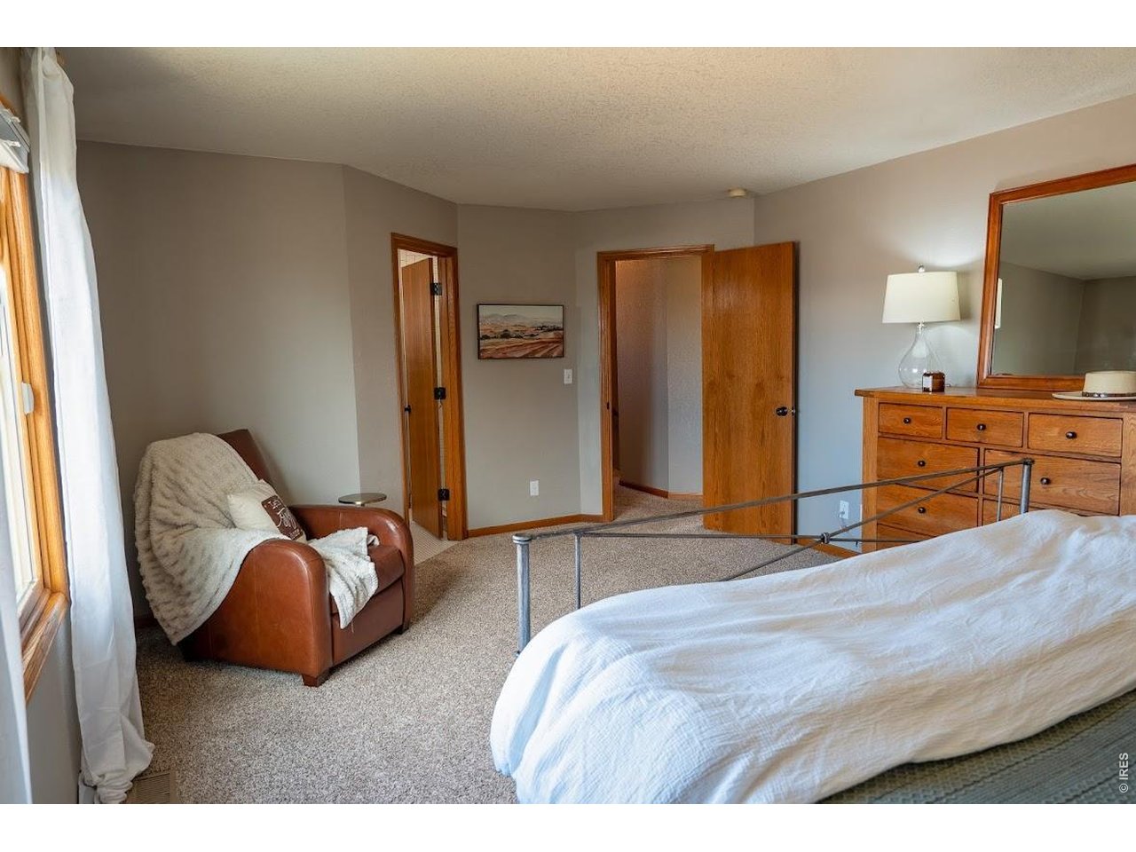 539 South 9th Street Berthoud, CO 80513 - Photo 11 of 37 a bedroom with a bed and window