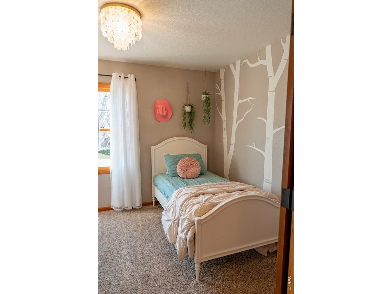 539 South 9th Street Berthoud, CO 80513 - Photo 13 of 37 a bedroom with a bed and a cabinets