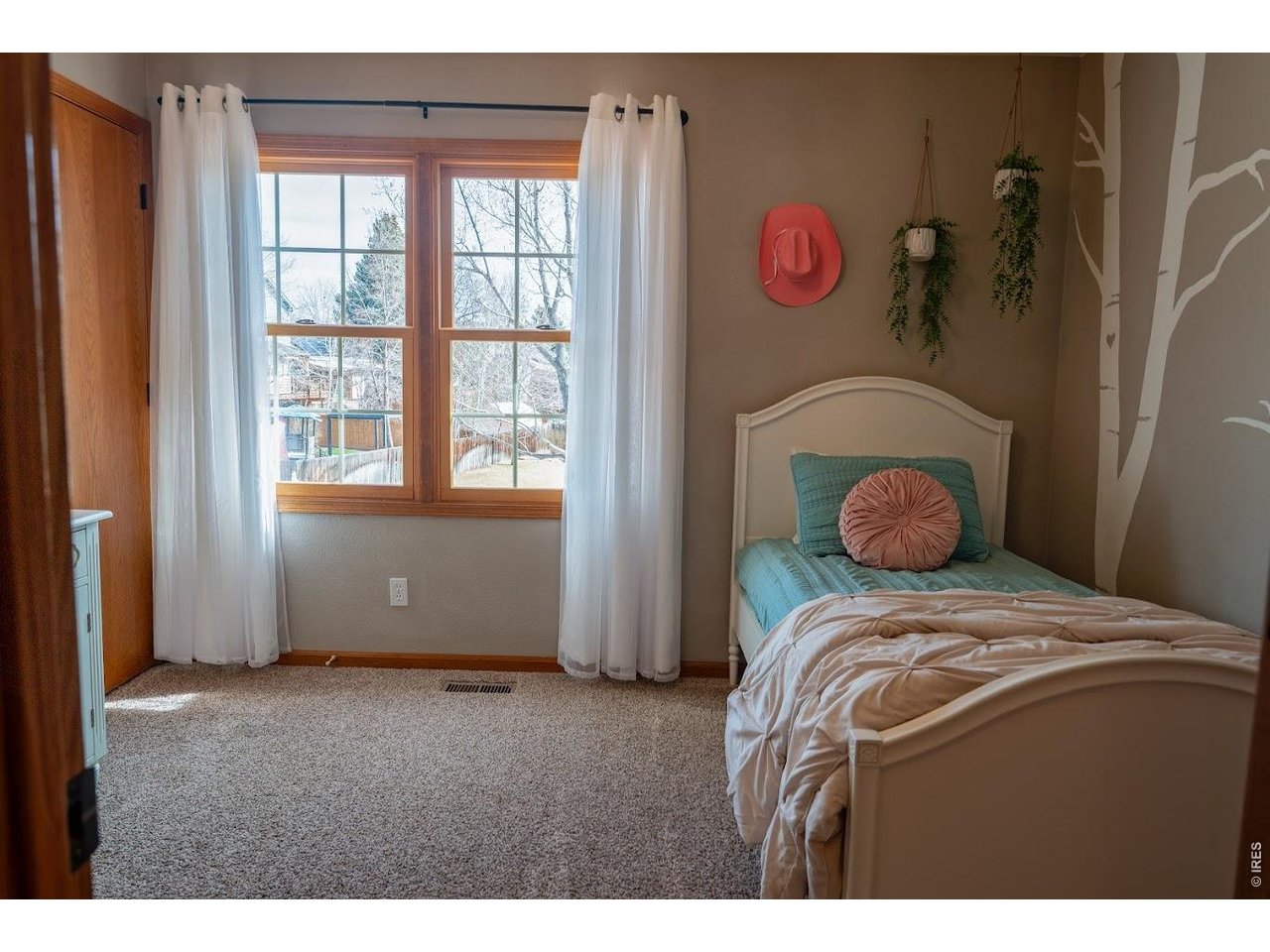 539 South 9th Street Berthoud, CO 80513 - Photo 14 of 37 a bedroom with a bed and a window