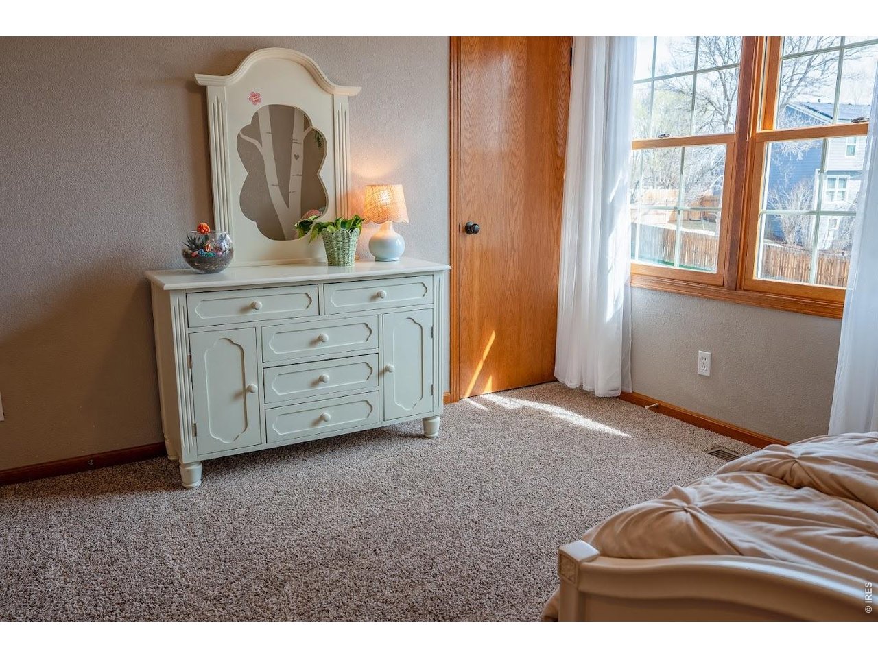 539 South 9th Street Berthoud, CO 80513 - Photo 15 of 37 a room with a bed and a dresser