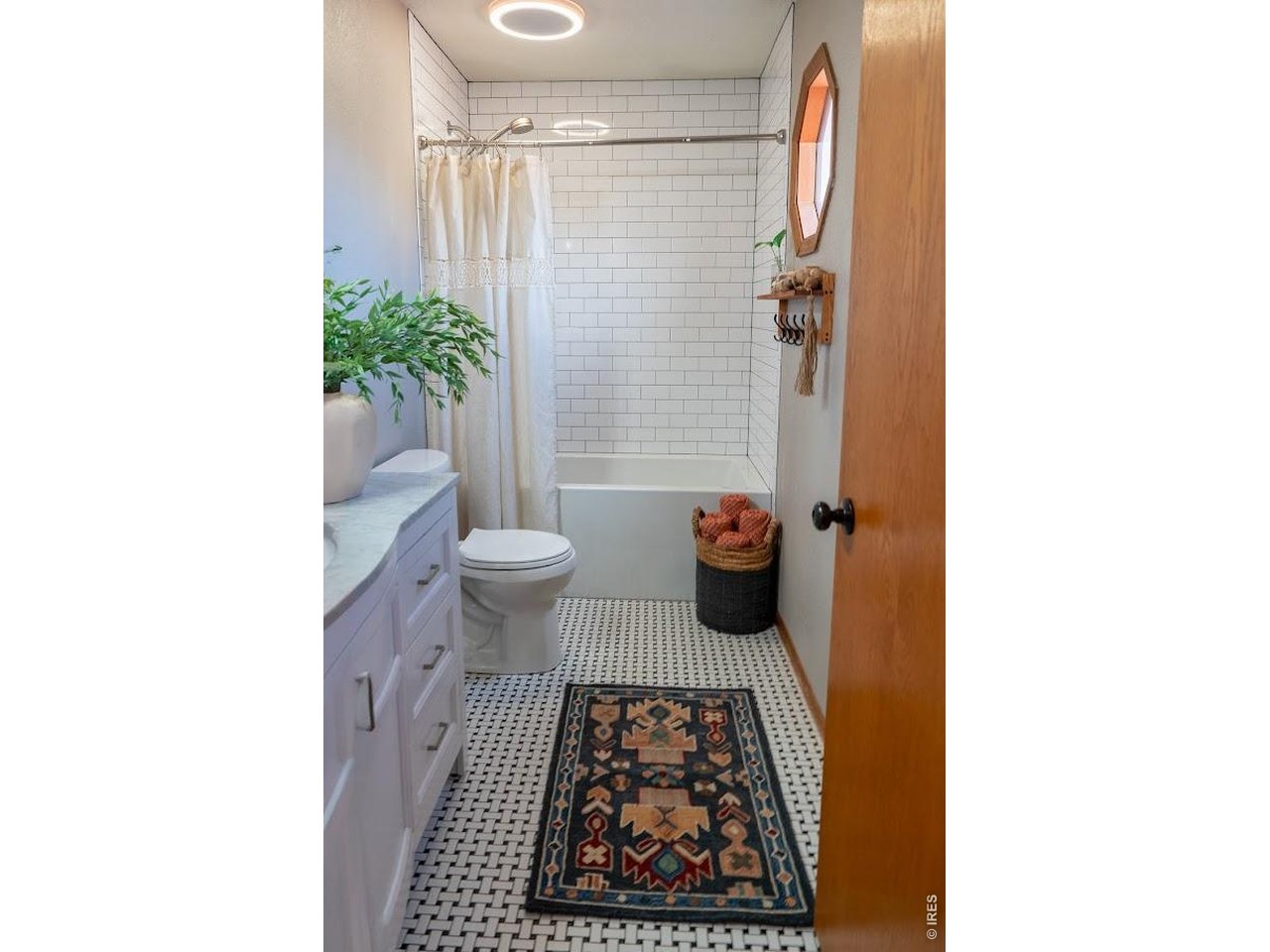 539 South 9th Street Berthoud, CO 80513 - Photo 18 of 37 a bathroom with a toilet and a shower