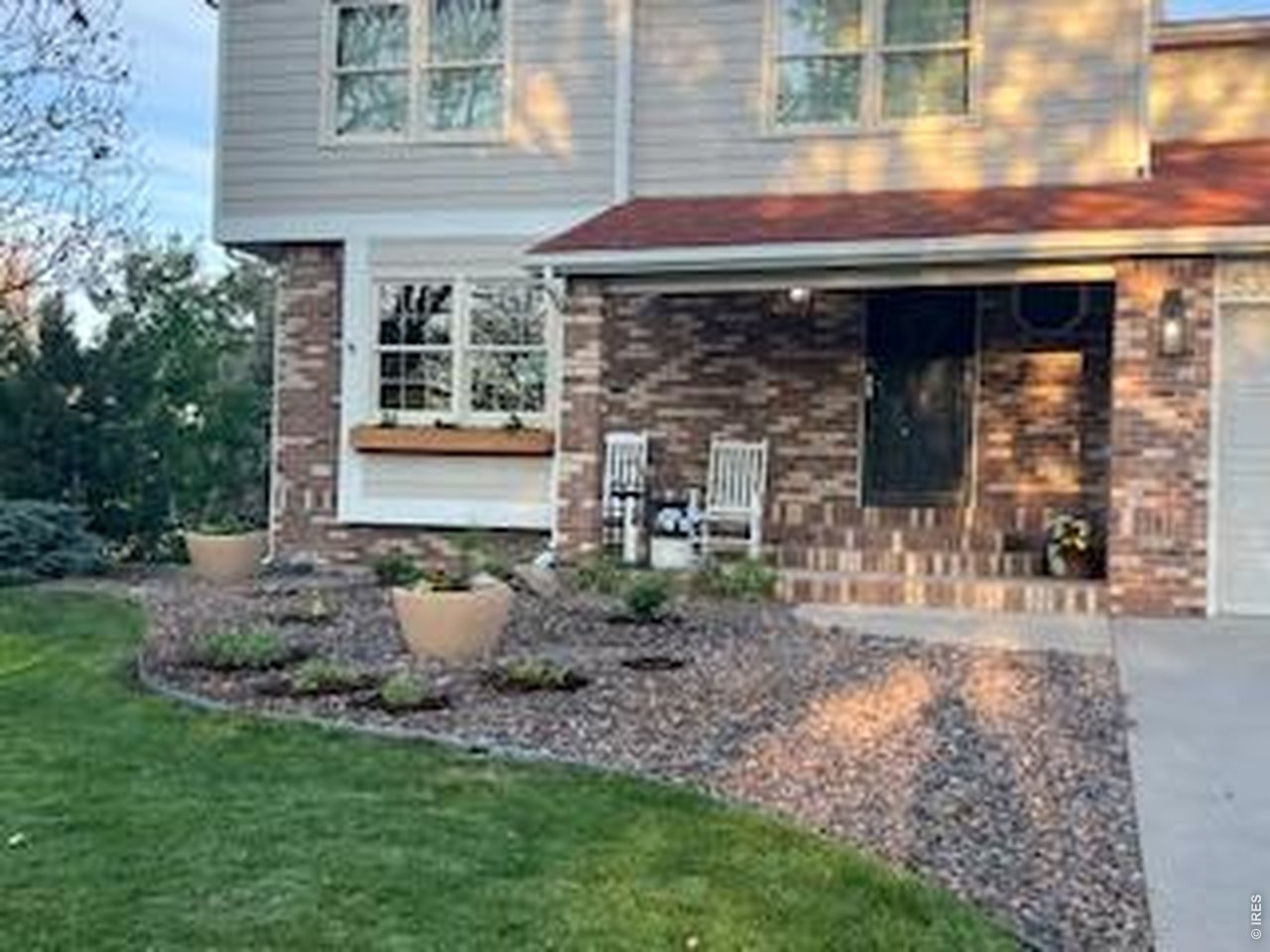 539 South 9th Street Berthoud, CO 80513 - Photo 2 of 37 a front view of a house with garden