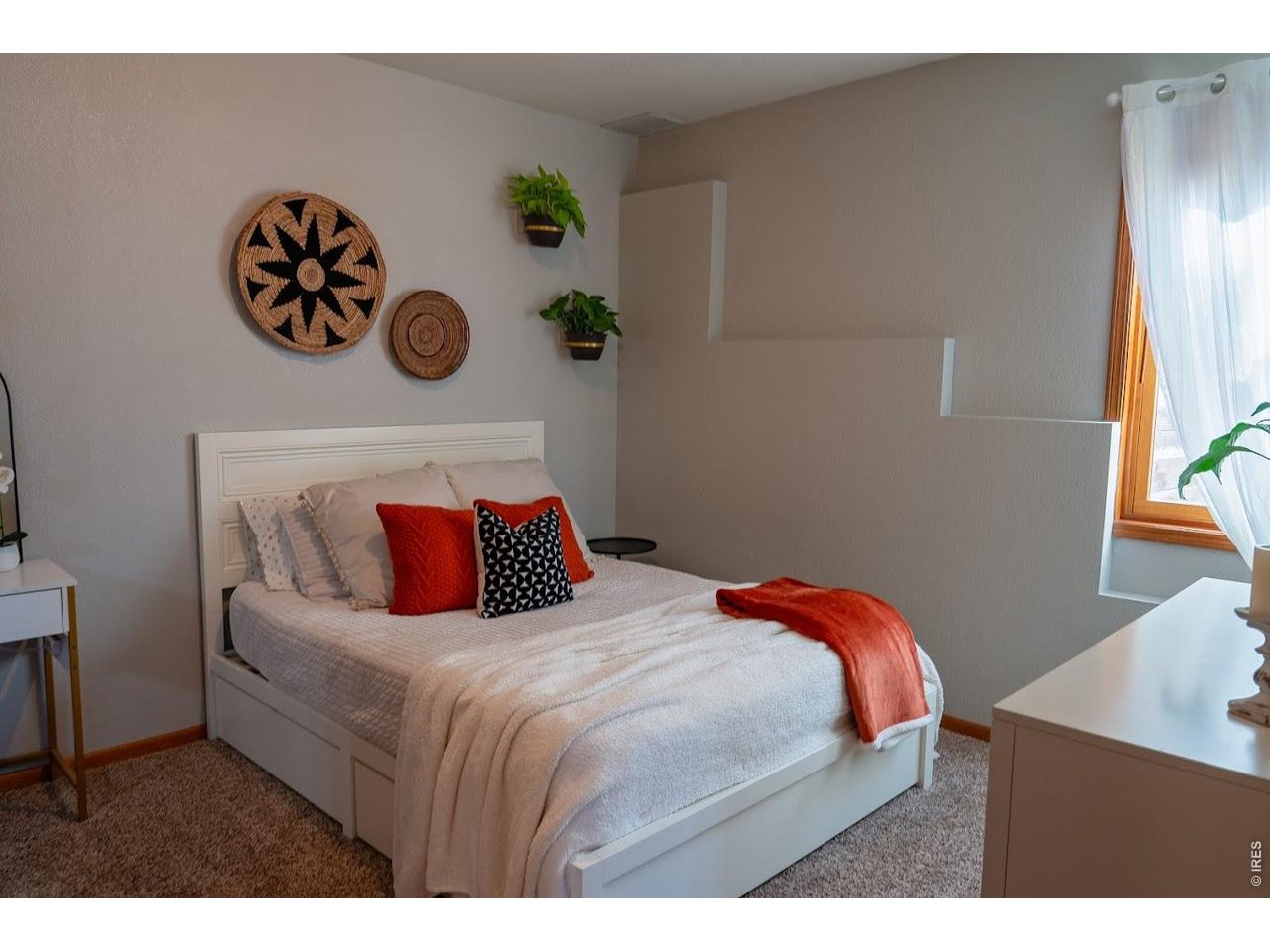 539 South 9th Street Berthoud, CO 80513 - Photo 20 of 37 a bedroom with a bed and a painting on the wall
