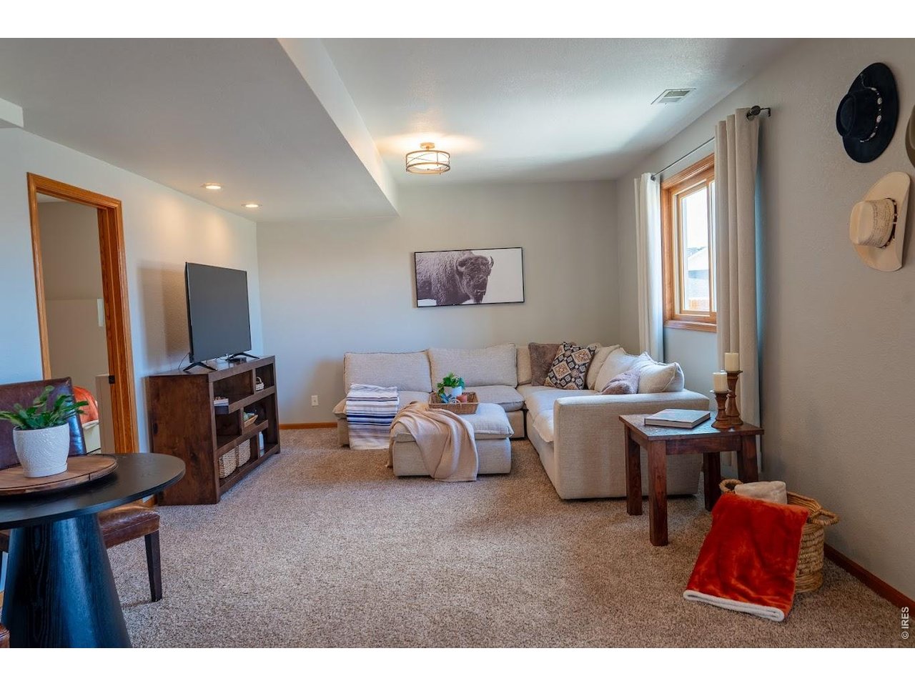 539 South 9th Street Berthoud, CO 80513 - Photo 22 of 37 a living room with furniture and a flat screen tv