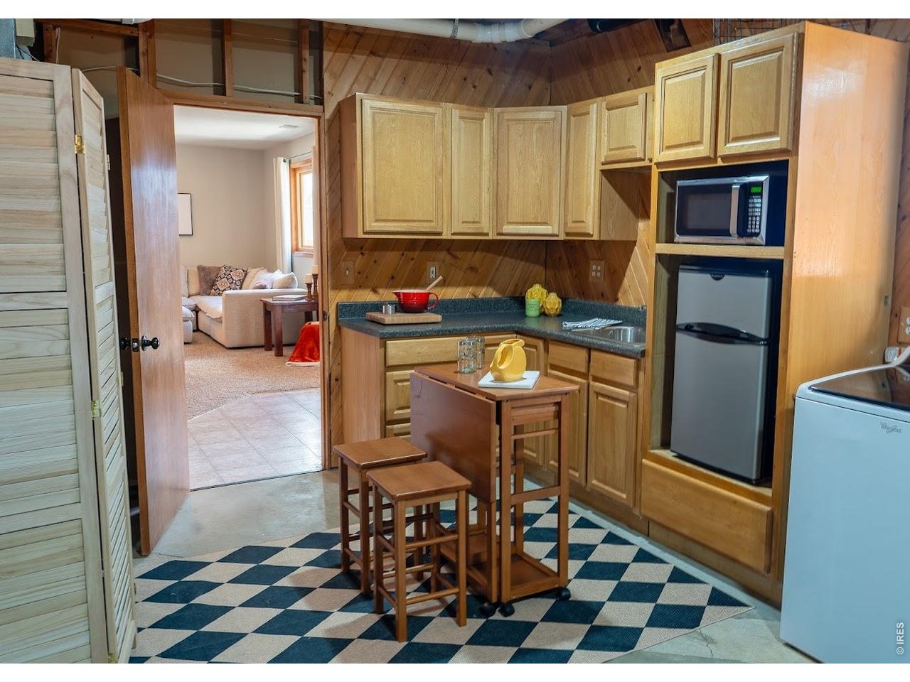 539 South 9th Street Berthoud, CO 80513 - Photo 23 of 37 a kitchen with a sink refrigerator and cabinets