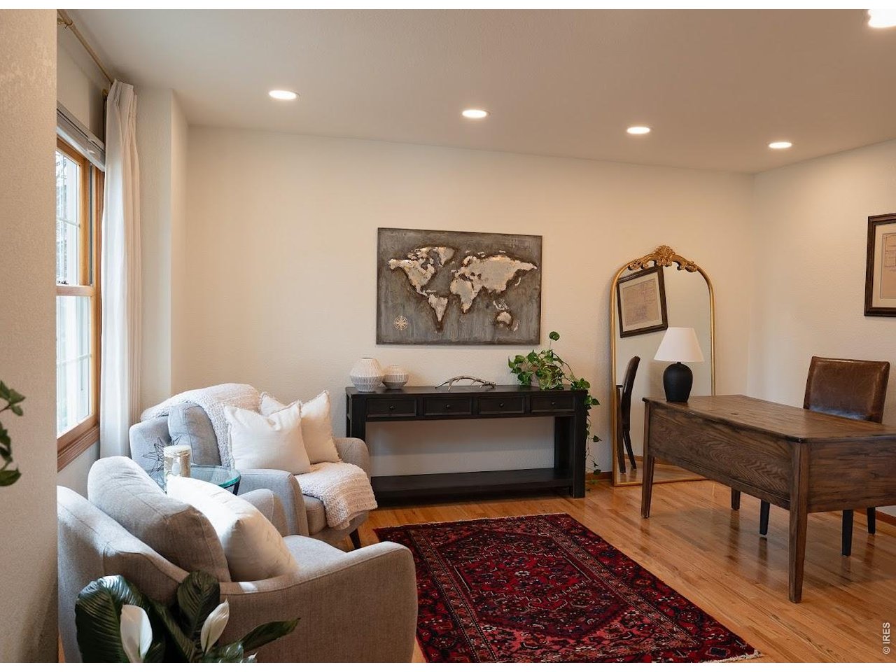 539 South 9th Street Berthoud, CO 80513 - Photo 3 of 37 a living room with furniture and a rug
