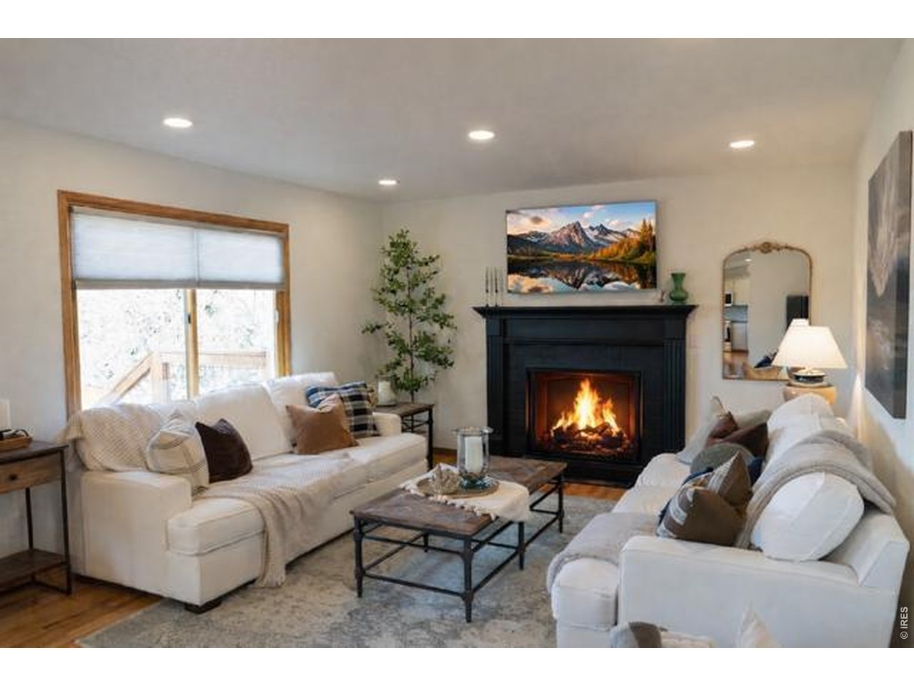 539 South 9th Street Berthoud, CO 80513 - Photo 37 of 37 a living room with furniture and a fireplace