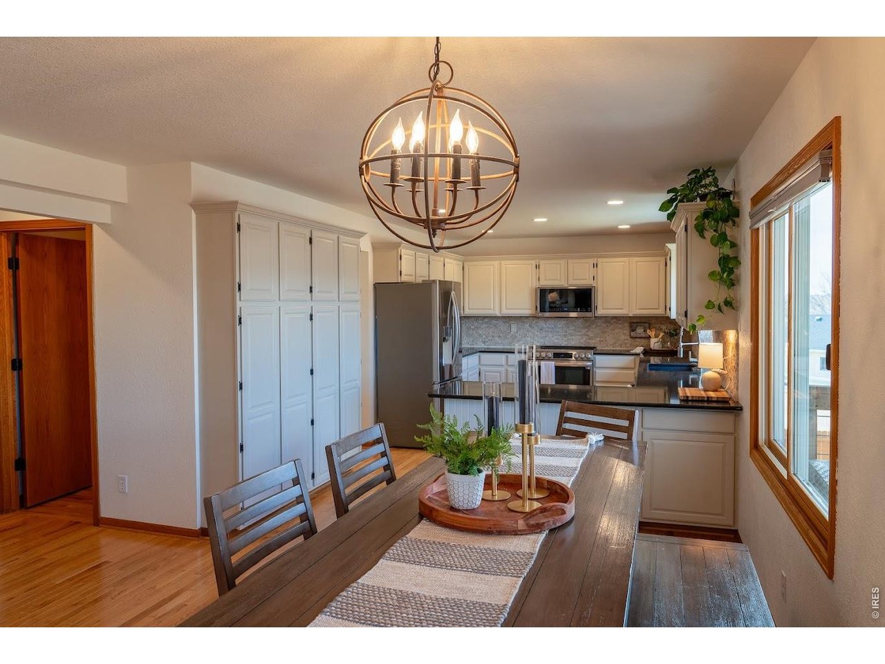 539 South 9th Street Berthoud, CO 80513 - Photo 4 of 37 a kitchen with stainless steel appliances kitchen island granite countertop a stove and cabinets