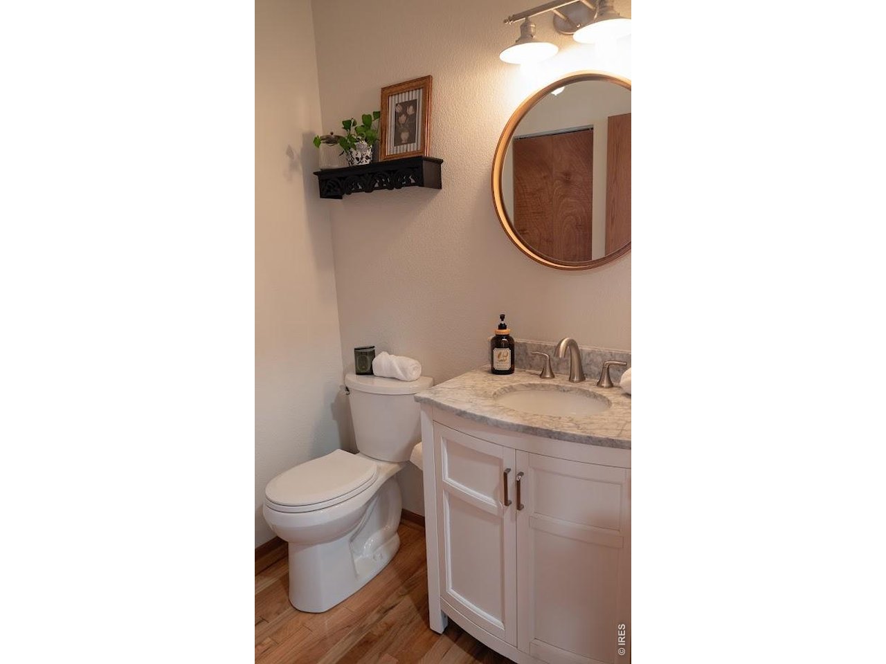 539 South 9th Street Berthoud, CO 80513 - Photo 8 of 37 a bathroom with a toilet and a sink