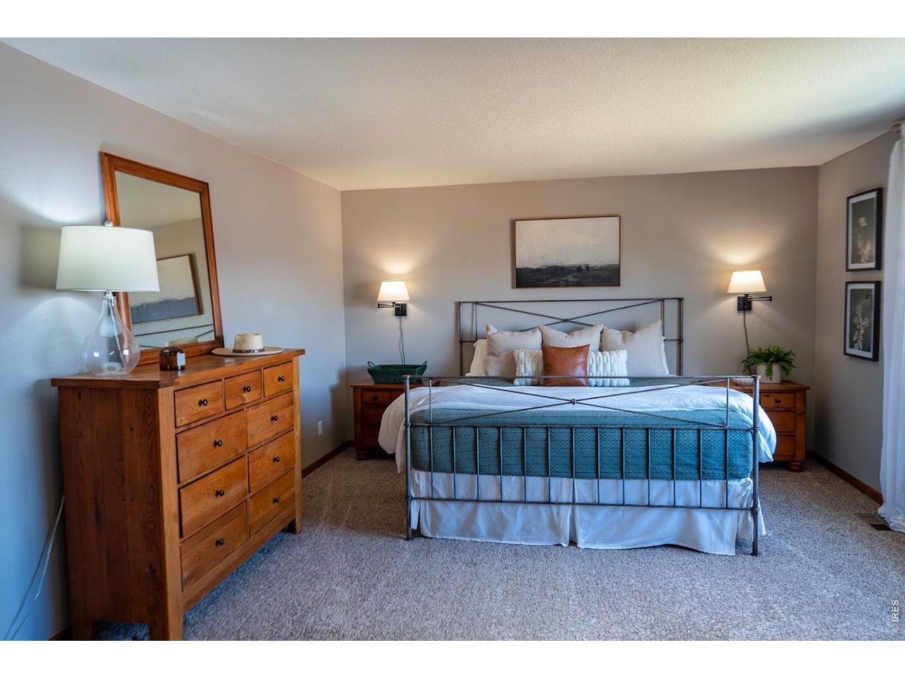 539 South 9th Street Berthoud, CO 80513 - Photo 9 of 37 a bedroom with a bed and a lamp on dresser