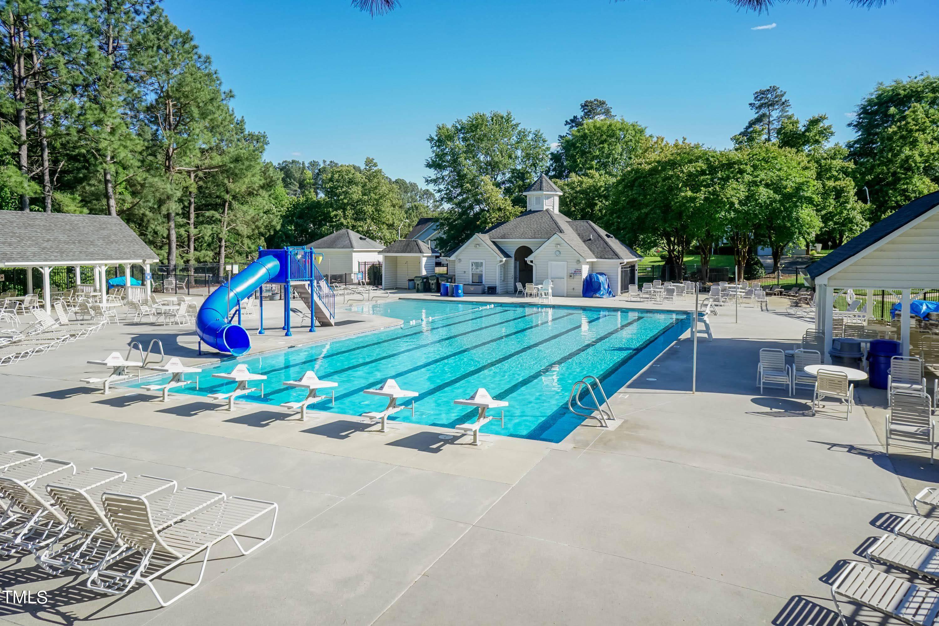 108 Solheim Lane Raleigh, NC 27603 - Photo 40 of 49 a view of playground with a slide and swing