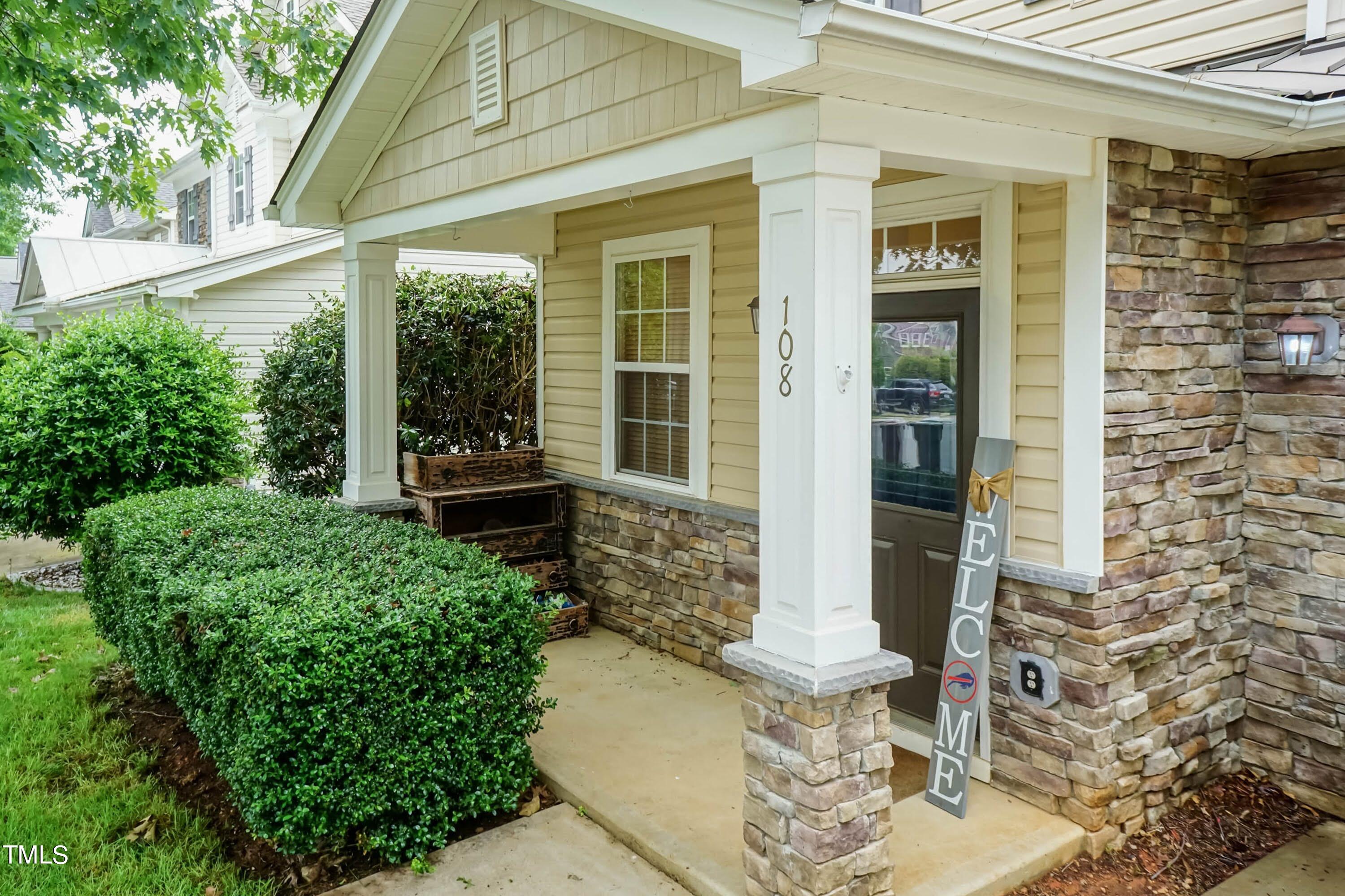 108 Solheim Lane Raleigh, NC 27603 - Photo 4 of 49 a front view of a house with a fountain