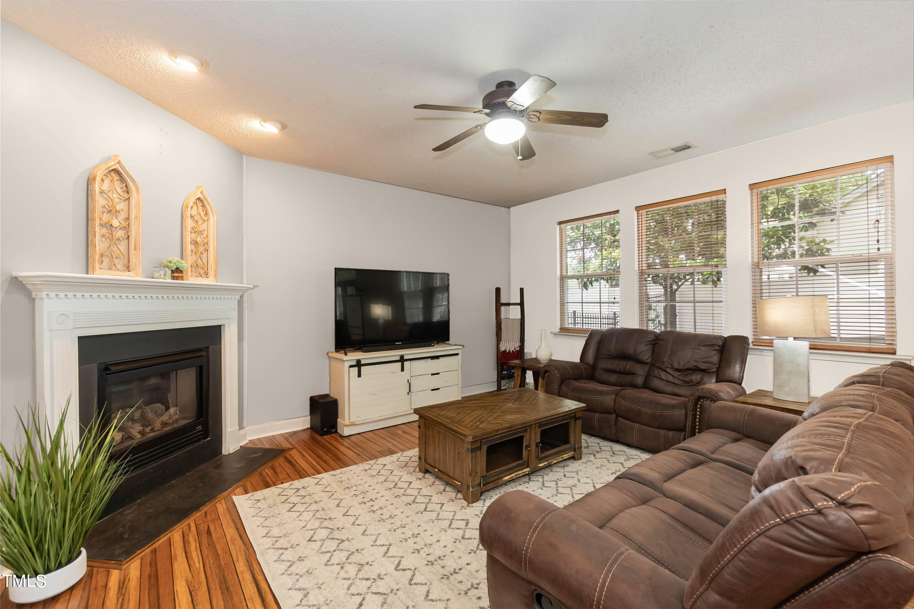 108 Solheim Lane Raleigh, NC 27603 - Photo 45 of 49 a living room with furniture and a fireplace