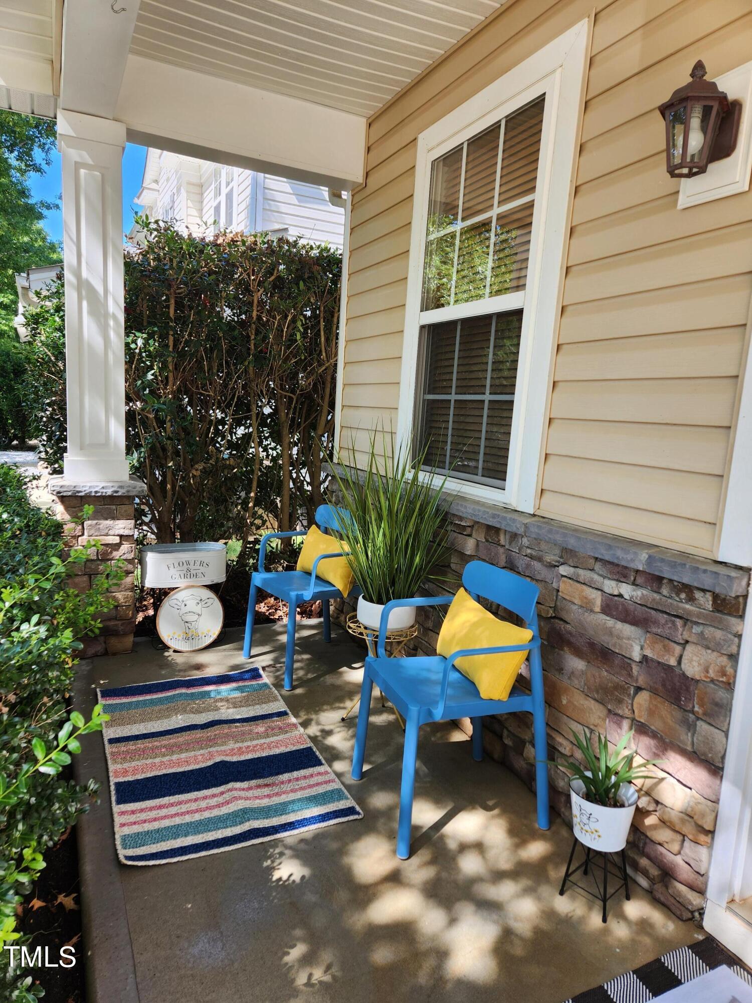 108 Solheim Lane Raleigh, NC 27603 - Photo 8 of 49 a table and chairs in front of the house