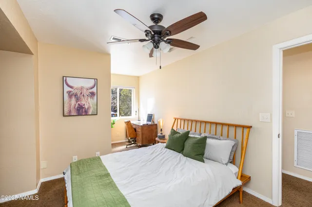 a bedroom with a bed and window