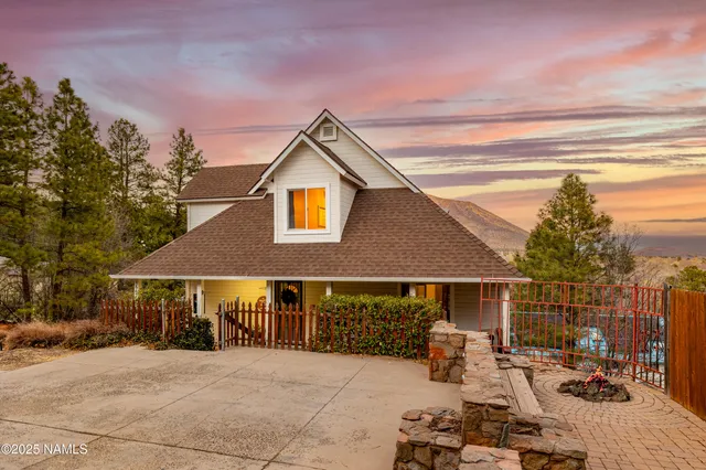 a front view of a house with sitting area