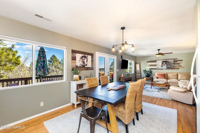a view of a dining room with furniture window and wooden floor