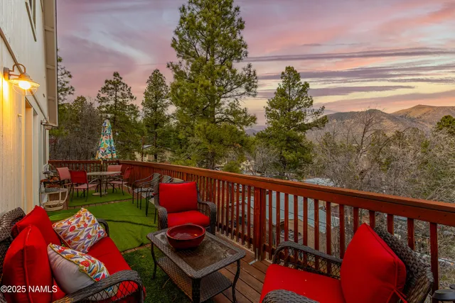 a view of a two chairs in the balcony