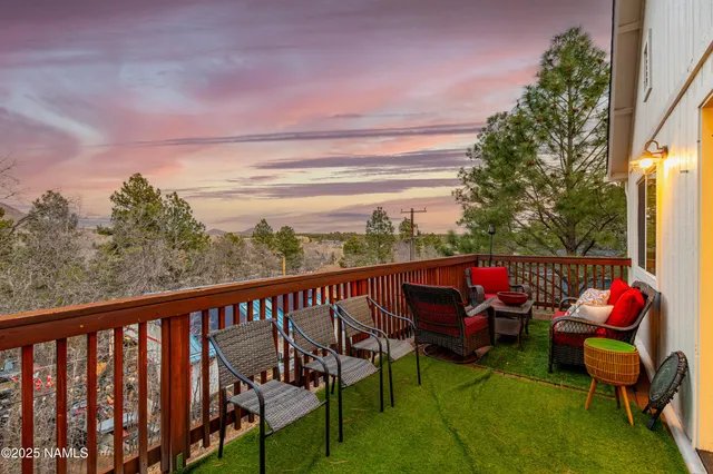 a view of balcony with furniture