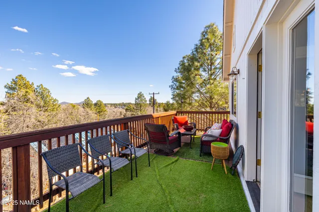 a view of a two chairs in the balcony