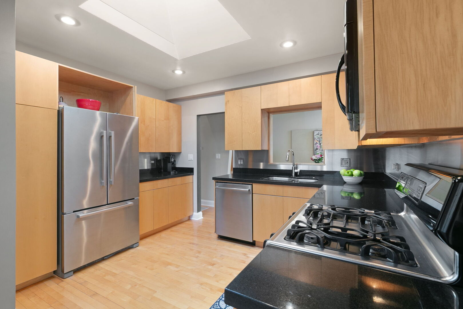 248 Gage Road Riverside, IL 60546 - Photo 3 of 28 a kitchen with stainless steel appliances granite countertop a refrigerator stove and sink