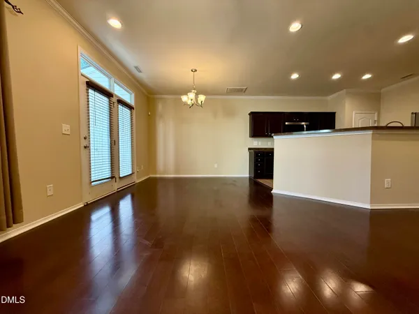 a view of a hall with wooden floor