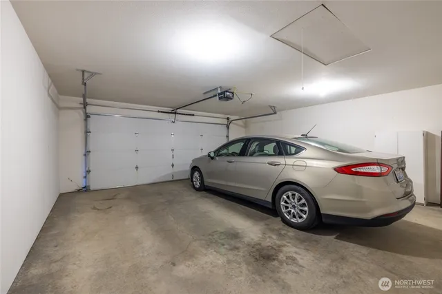a view of a garage and car parked
