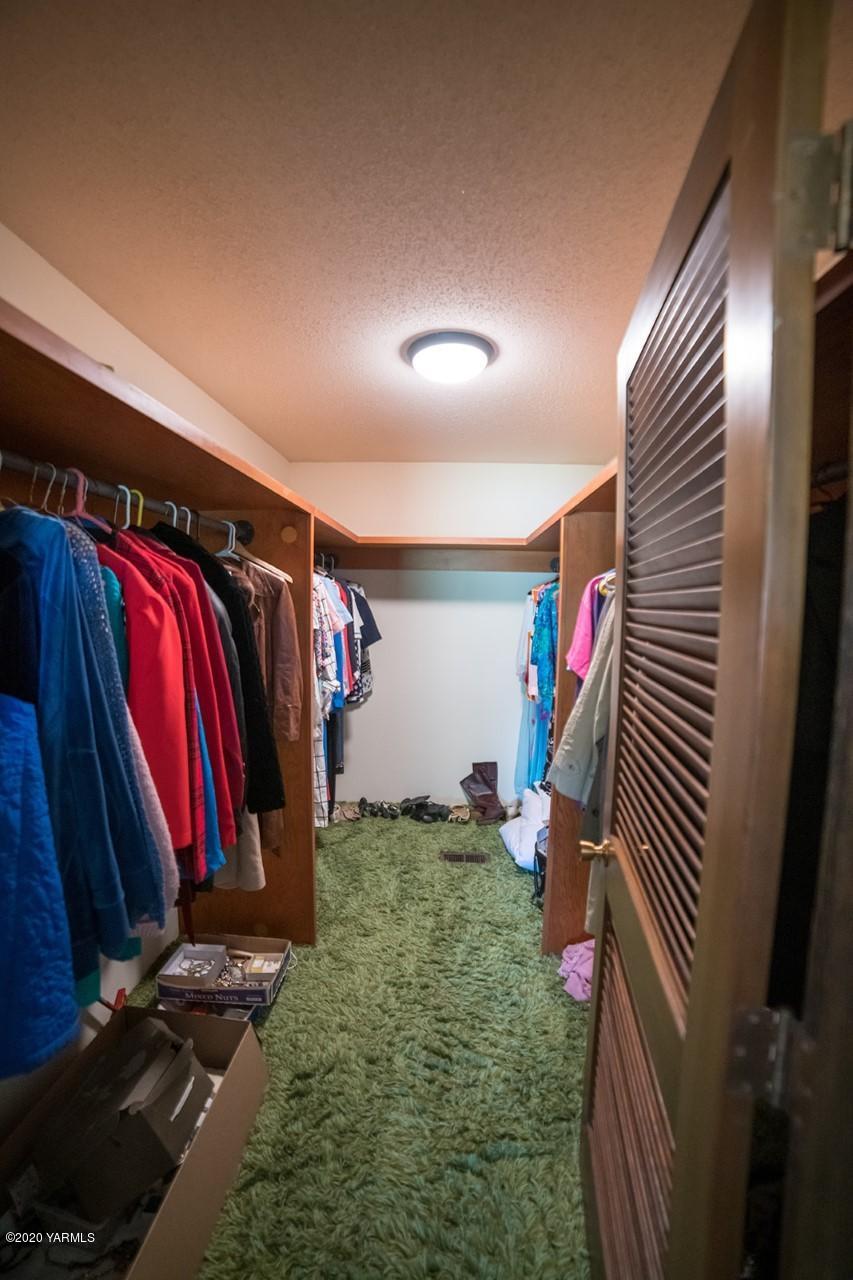 8540-2 Fort Road Wapato, WA 98951 - Photo 21 of 55 a view of walk in closet with clothes and shoes