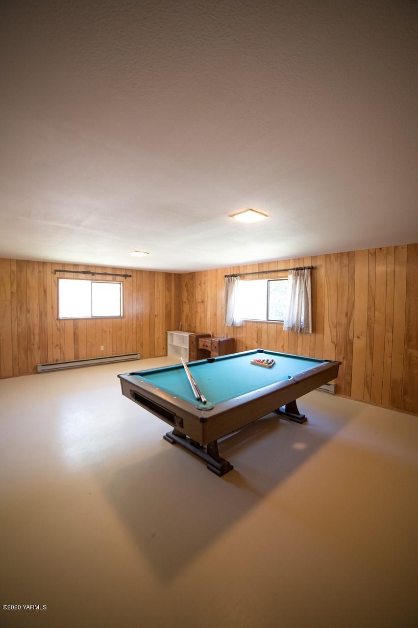 8540-2 Fort Road Wapato, WA 98951 - Photo 27 of 55 a living room with a pool table and windows