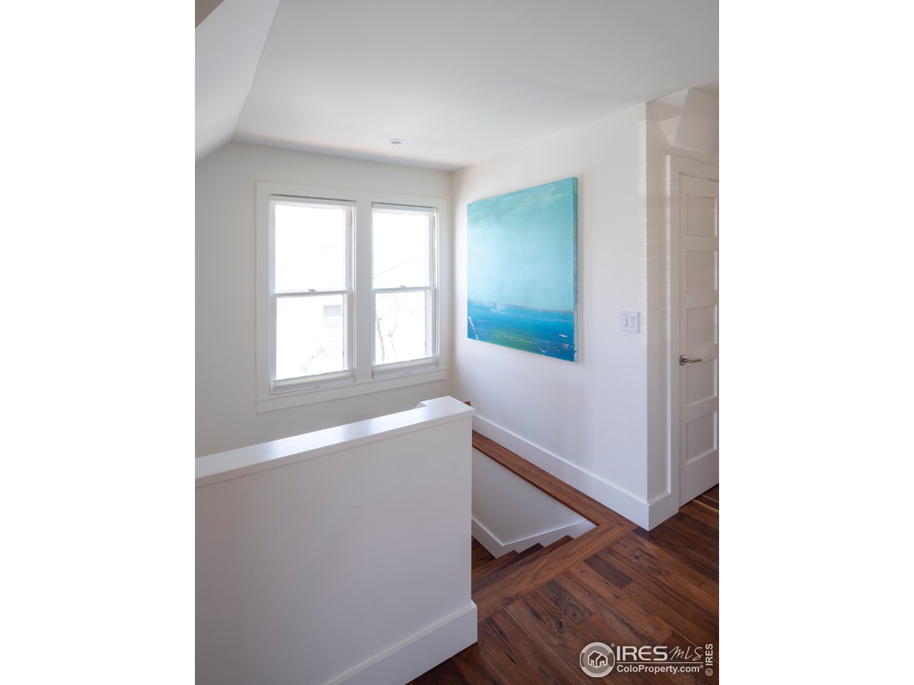 704 Concord Avenue Boulder, CO 80304 - Photo 16 of 27 a view of an empty room with wooden floor and a window