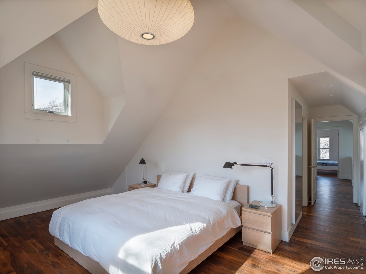704 Concord Avenue Boulder, CO 80304 - Photo 17 of 27 a bedroom with bed and wooden floor