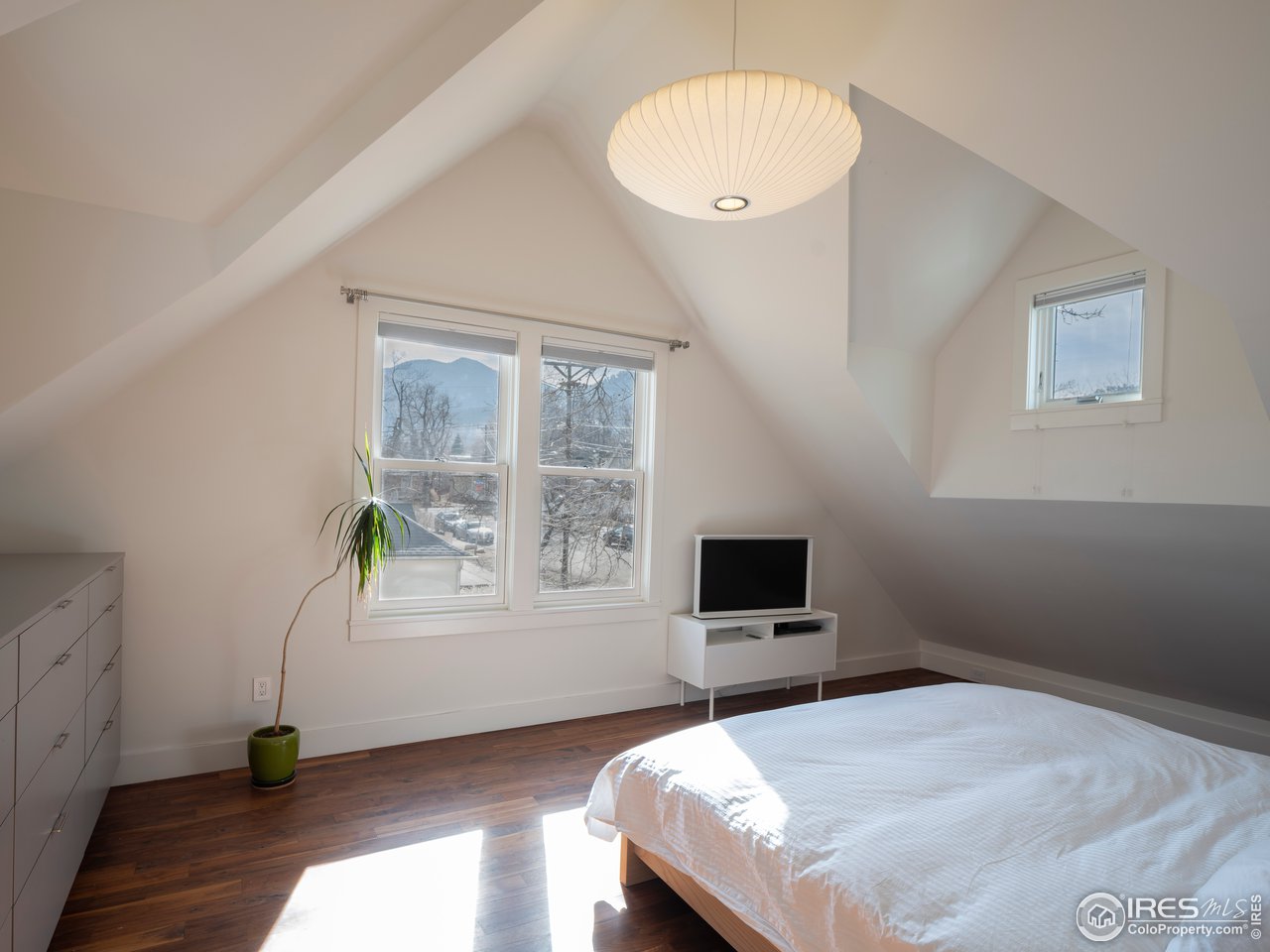 704 Concord Avenue Boulder, CO 80304 - Photo 18 of 27 a bedroom with a bed and a window