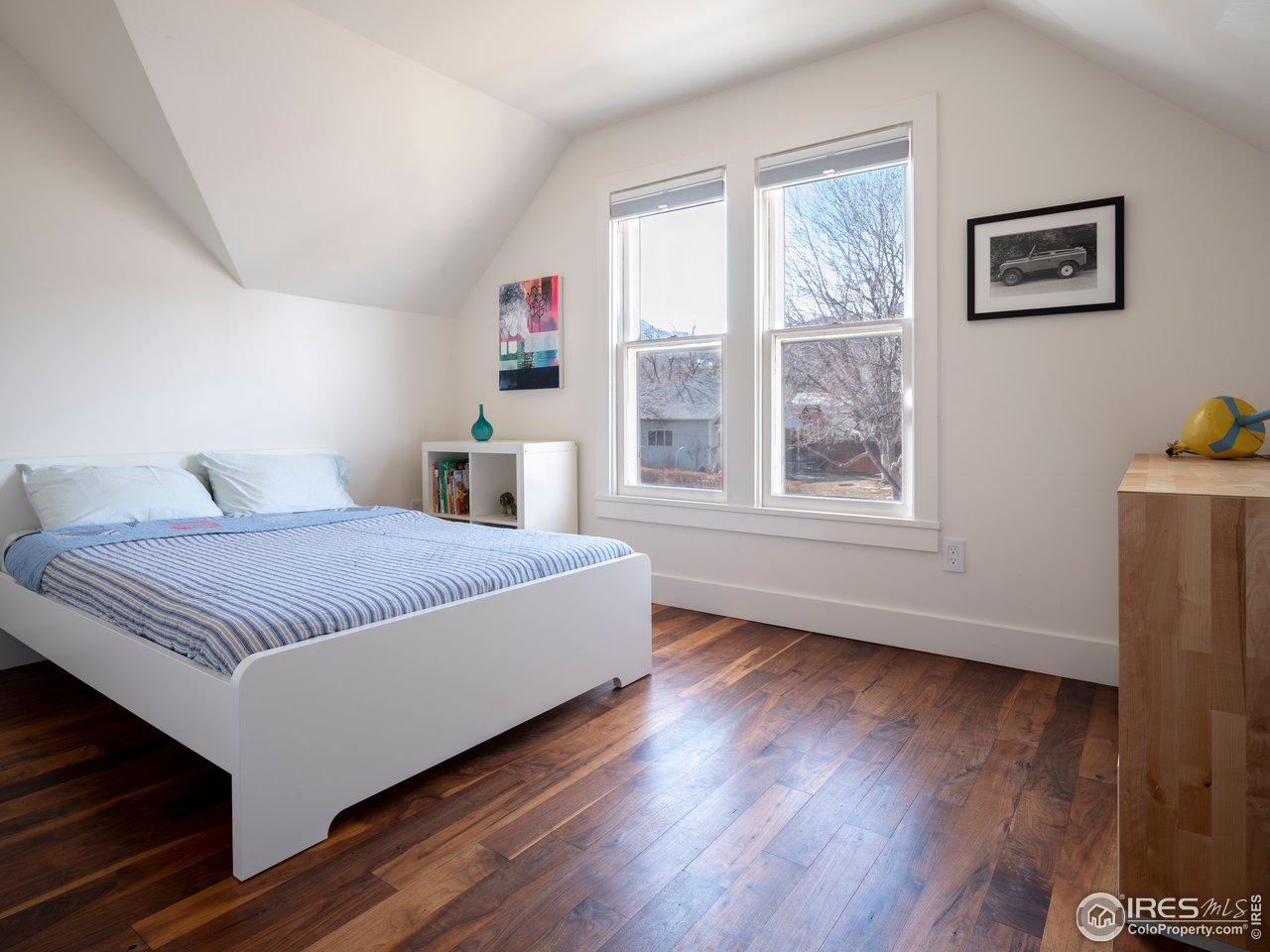 704 Concord Avenue Boulder, CO 80304 - Photo 21 of 27 a bedroom with a large bed and a window