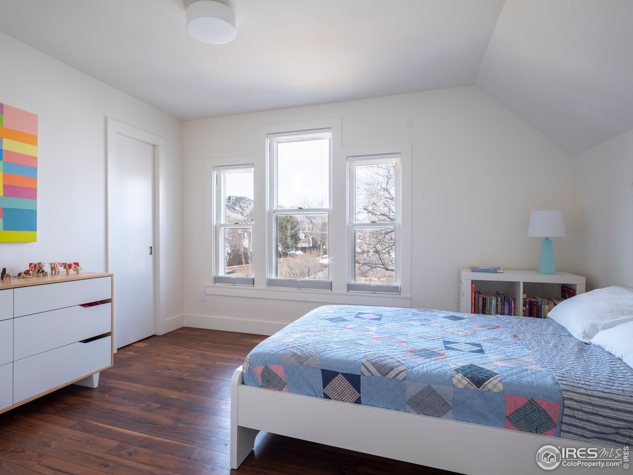 704 Concord Avenue Boulder, CO 80304 - Photo 22 of 27 a bedroom with a bed and a window