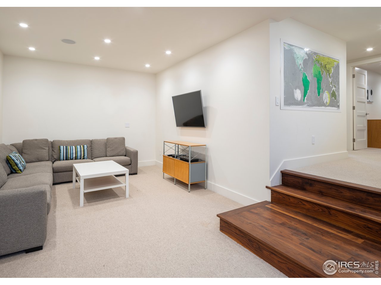 704 Concord Avenue Boulder, CO 80304 - Photo 24 of 27 a living room with furniture and a flat screen tv