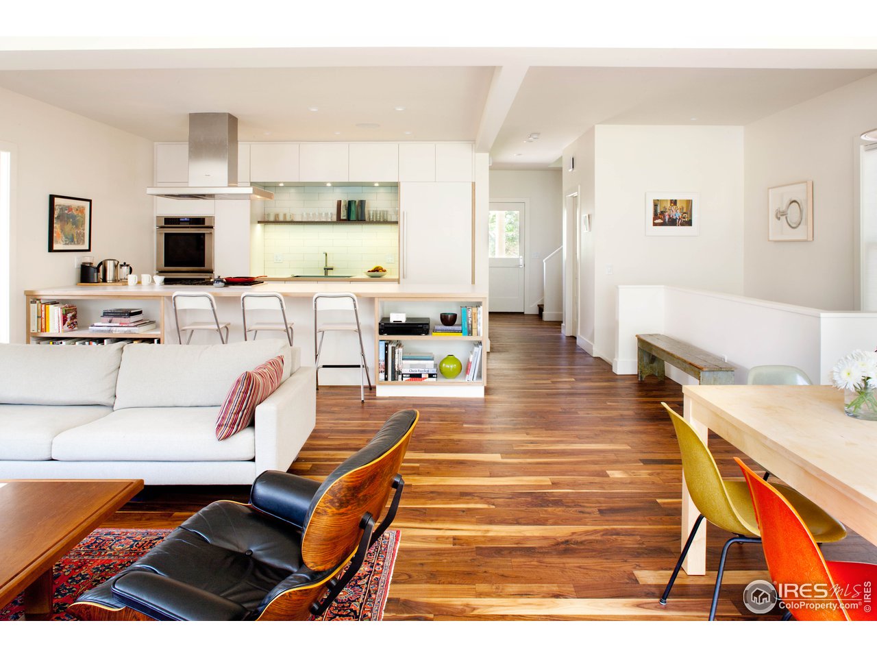 704 Concord Avenue Boulder, CO 80304 - Photo 5 of 27 a living room with furniture a flat screen tv and a table