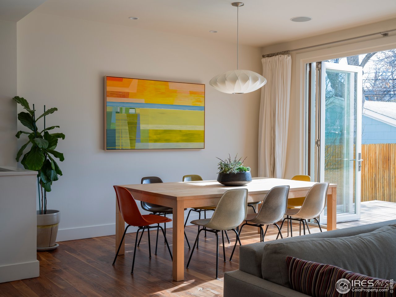 704 Concord Avenue Boulder, CO 80304 - Photo 7 of 27 a view of a dining room with furniture and a potted plant