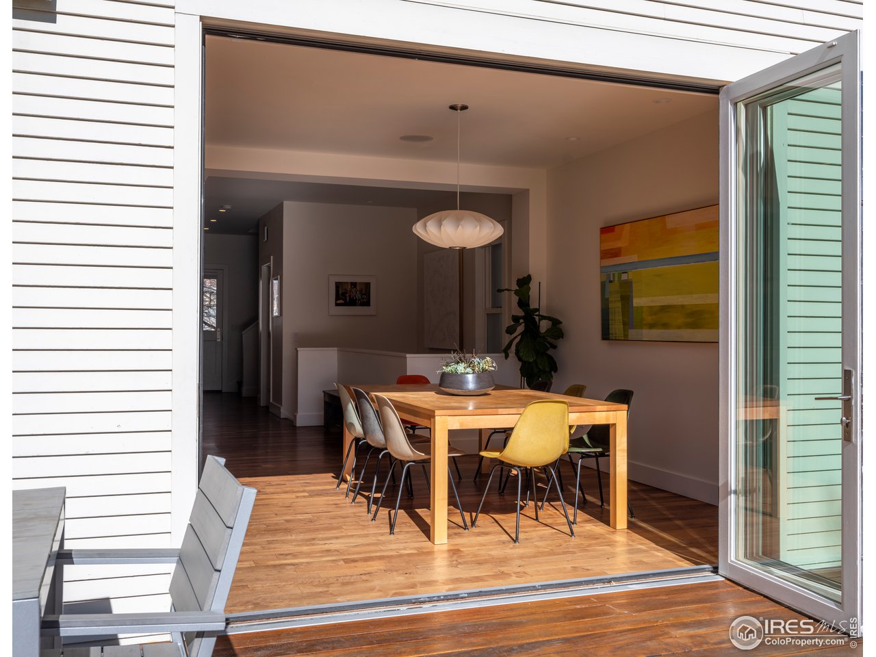 704 Concord Avenue Boulder, CO 80304 - Photo 8 of 27 a view of a dining room with furniture and wooden floor