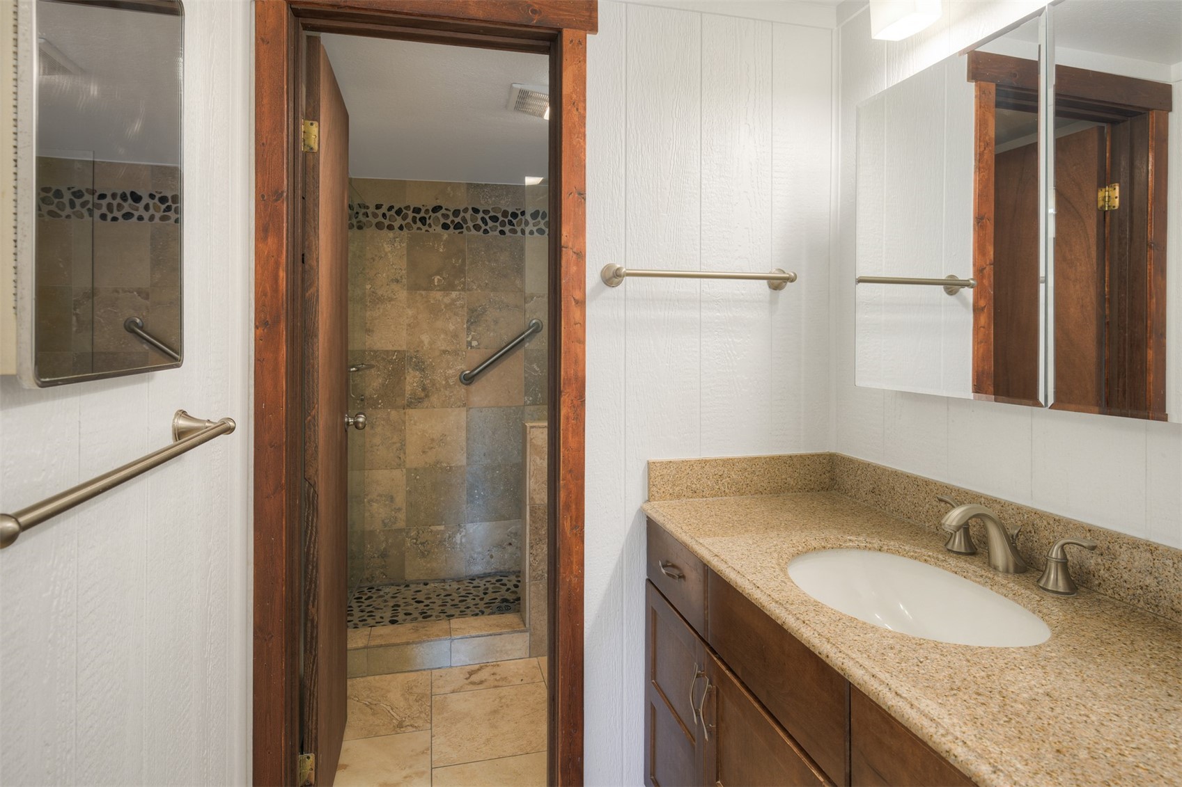 132 Illinois Gulch Road, Unit 3 Breckenridge, CO 80424 - Photo 20 of 32 a bathroom with a granite countertop sink and a mirror